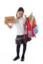 Sweet little latin school girl carrying heavy backpack or schoolbag full