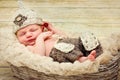 Sweet little newborn baby lying in the wicker basket