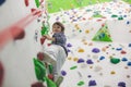 Sweet little preschool boy, climbing wall indoors Royalty Free Stock Photo