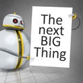 sweet little robot holding a white board with the message the ne Royalty Free Stock Photo