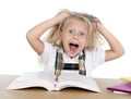 Sweet little school girl pulling her blonde hair in stress getting crazy while studying