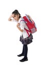 Sweet little school girl in stress carrying very heavy backpack or schoolbag full Royalty Free Stock Photo