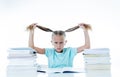 Sweet little schoolgirl feeling exhausted and stress by load of homework and schoolwork Royalty Free Stock Photo