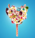 Sweet Lolipop in Heart form of whipped cream with sweets, jellies, heart front view. Crazy freakshake food trend. Front