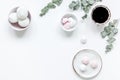 Sweet lunch with marsh-mallow and spring flowers for woman on white background top view mockup