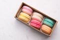 Sweet macarons. Different french cookies macaroons in a paper bo