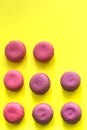 Sweet macaroons on yellow abstraction background,with copy space