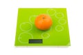 Sweet mandarin on scales Royalty Free Stock Photo