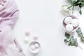 Sweet marsh-mallow and flowers on woman white desk background top view mockup