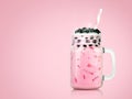 Sweet milk tea with bubbles in clear glass and drinking straws on pink background. Thai milk with black pearls Royalty Free Stock Photo