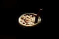 Sweet Milkshake with caramel syrup,cream liqueur,chocolate powder on black background