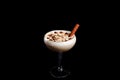 Sweet Milkshake with caramel syrup,cream liqueur,chocolate powder on black background