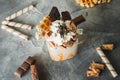 Sweet milkshake drink with dripping sauce, cream and chocolate Royalty Free Stock Photo