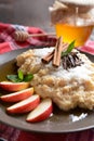 Sweet millet porridge with honey, apples and grated coconut