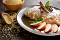 Sweet millet porridge with honey, apples and grated coconut