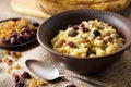 Sweet millet porridge with raisins and dried cranberries