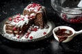 Sweet moments - sweet moments - brownies poured hot, liquid chocolate, sprinkled with red pomegranate seeds and powdered sugar Royalty Free Stock Photo