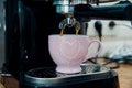 Sweet morning weekend at home - close up of coffee machine pouring espresso with soft background Royalty Free Stock Photo