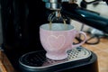 Sweet morning weekend at home - close up of coffee machine pouring espresso with soft background Royalty Free Stock Photo