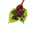 sweet mulberries and wood spoon on Green leaf and white backgro Royalty Free Stock Photo