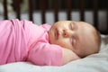 Sweet Newborn Baby Girl Asleep in Crib Royalty Free Stock Photo