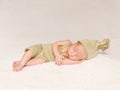 Sweet newborn baby sleeping in costume and hat Royalty Free Stock Photo