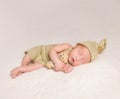 Sweet newborn baby sleeping in costume and hat Royalty Free Stock Photo