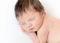 Sweet newborn baby sleeping on white blanket Royalty Free Stock Photo