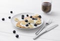 Sweet oatmeal pancakes with cream, blueberry and banana. Healthy Breakfast concept Royalty Free Stock Photo