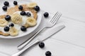 Sweet oatmeal pancakes with cream, blueberry and banana. Healthy Breakfast concept Royalty Free Stock Photo