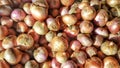 Sweet onions background with selective focus on sale openly in a night market. Royalty Free Stock Photo