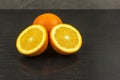 Sweet orange cut on a wooden table.