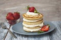 Sweet Pancakes with Cream and Strawbery. Health Breakfast Fruit Berry Vitamine Gray Rustic Wooden Background Royalty Free Stock Photo