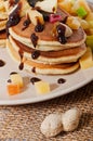 Sweet pancakes with fruits, candied fruits and cheese, homemade Royalty Free Stock Photo