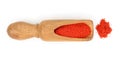 Sweet paprika spice in a wooden spoon isolated on white background. Top view. Flat lay Royalty Free Stock Photo