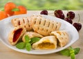 Sweet pastries with cherry and apricot jam