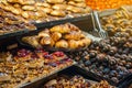 Sweet pastries, croissants, pies, cookies on the counter of the street market