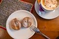 Sweet pastries (FranzbrÃ¶tchen) and a cup of cappuccino Royalty Free Stock Photo