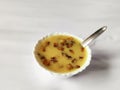 Sweet payasam or stew Kerala delicious dish in a bowl with spoon isolated on white background