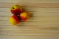 Sweet peaches on a wooden table top view Royalty Free Stock Photo