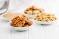 Sweet peanut brittle, peanuts and peanuts butter on white table Royalty Free Stock Photo