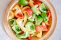 Sweet Pepper Cutting Sliced Preparation for Cooking. Raw Variety Red, Green, Yellow Sweet Peppers Slicing Chopped in Wooden Bowl Royalty Free Stock Photo