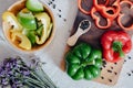 Sweet Pepper Cutting Sliced Preparation for Cooking. Raw Variety Red, Green, Yellow Sweet Peppers Slicing Chopped in Wooden Bowl Royalty Free Stock Photo