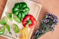 Sweet Pepper Cutting Sliced Preparation for Cooking. Raw Variety Red, Green, Yellow Sweet Peppers Slicing Chopped in Wooden Bowl Royalty Free Stock Photo