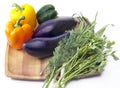 Sweet pepper, eggplant, parsley and fennel on a wooden tray