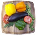 Sweet pepper, tomato, eggplant, parsley and fennel on a wooden tray