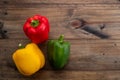 Sweet pepper on wood background, paprika, red, green and yellow sweet bell peppers on table Royalty Free Stock Photo