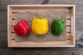 Sweet pepper on wood background, paprika, red, green and yellow sweet bell peppers on table Royalty Free Stock Photo