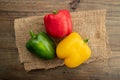 Sweet pepper on wood background, paprika, red, green and yellow sweet bell peppers on table Royalty Free Stock Photo