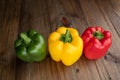 Sweet pepper on wood background, paprika, red, green and yellow sweet bell peppers Royalty Free Stock Photo